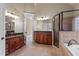 Primary bathroom with double vanities, granite counters, tiled floor, shower, and separate tub at 10014 Hammock Bend Bnd, Chapel Hill, NC 27517