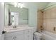 Bathroom with a large vanity mirror, bathtub, and shower at 10014 Hammock Bend Bnd, Chapel Hill, NC 27517