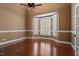 Bright and spacious bedroom featuring hardwood floors, bay windows, and neutral paint, creating a cozy atmosphere at 10014 Hammock Bend Bnd, Chapel Hill, NC 27517