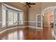 Inviting bedroom with hardwood floors, bay windows, and classic trim, perfect for relaxing or working from home at 10014 Hammock Bend Bnd, Chapel Hill, NC 27517