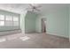 Bright bedroom featuring a built-in window bench and neutral carpet at 10014 Hammock Bend Bnd, Chapel Hill, NC 27517