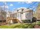 Charming home featuring a screened porch, wood deck, and beautifully landscaped backyard at 10014 Hammock Bend Bnd, Chapel Hill, NC 27517