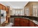 Open kitchen featuring granite countertops, stainless steel appliances, and a sunny breakfast nook at 10014 Hammock Bend Bnd, Chapel Hill, NC 27517