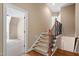 Carpeted staircase with wood and iron railing at 10014 Hammock Bend Bnd, Chapel Hill, NC 27517