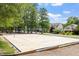 Sandy volleyball court offers a fun recreational amenity for residents, complemented by nearby homes at 10014 Hammock Bend Bnd, Chapel Hill, NC 27517