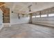 Spacious two car garage with storage shelving and an automatic garage door at 1012 Seedling Ct, Durham, NC 27703