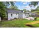 Large, grassy backyard with a stone patio, perfect for entertaining and relaxing at 106 N Trail Dr, Raleigh, NC 27615