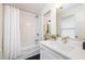 Well-lit bathroom with white subway tile in the shower and a white stone counter at 106 N Trail Dr, Raleigh, NC 27615