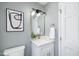 Cozy bathroom featuring updated fixtures, a modern mirror, and stylish decor at 106 N Trail Dr, Raleigh, NC 27615