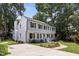 Charming two-story home with a manicured lawn and a spacious driveway at 106 N Trail Dr, Raleigh, NC 27615
