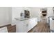 Modern kitchen with stainless steel appliances, white cabinets, and a kitchen island at 106 N Trail Dr, Raleigh, NC 27615