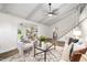 Inviting living room featuring stylish seating, a ceiling fan, and access to a cozy dining area at 106 N Trail Dr, Raleigh, NC 27615