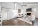 Spacious living room with a fireplace, vaulted ceilings, and a view of the upstairs loft at 106 N Trail Dr, Raleigh, NC 27615