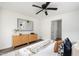 Inviting bedroom featuring a statement wall, a warm color palette, and stylish furnishings at 106 N Trail Dr, Raleigh, NC 27615