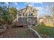 Fenced backyard featuring a wooden deck and well-maintained lawn at 107 Bond St, Durham, NC 27707