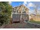 View of the backyard featuring a wooden deck and well-maintained lawn at 107 Bond St, Durham, NC 27707