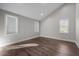 Bright and airy bedroom with large windows and hardwood floors, offering a comfortable retreat at 107 Bond St, Durham, NC 27707