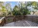 A cozy wooden deck overlooking a landscaped backyard provides a relaxing outdoor space at 107 Bond St, Durham, NC 27707