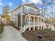 Charming two-story home with a welcoming front porch, showcasing its appealing exterior design at 107 Bond St, Durham, NC 27707