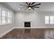 A modern living room features an elegant fireplace and hardwood floors throughout at 107 Bond St, Durham, NC 27707