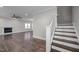 Spacious living room with hardwood floors, fireplace, and staircase leading to the upper level at 107 Bond St, Durham, NC 27707