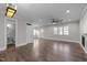 A spacious living room boasts gleaming hardwood floors and a charming decorative fireplace at 107 Bond St, Durham, NC 27707