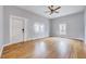 Spacious living room featuring hardwood floors, ample natural light, and a classic ceiling fan at 118 S Guthrie Ave, Durham, NC 27703