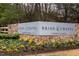 Stone sign with colorful flowers reading 'Briar Chapel by Newland Communities' at 1243 Great Ridge Pkwy, Chapel Hill, NC 27516