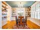 Elegant dining room with custom built-ins, wainscoting, and a large window for natural light, perfect for gatherings at 1243 Great Ridge Pkwy, Chapel Hill, NC 27516