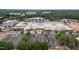 A shopping center surrounded by trees, showcasing the community's accessibility to amenities at 130 S Estes Dr # G3, Chapel Hill, NC 27514