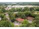 Aerial view showcases the community's layout nestled among lush trees, with convenient parking and easy access to nearby amenities at 130 S Estes Dr # G3, Chapel Hill, NC 27514