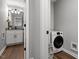Bathroom and laundry area combination featuring modern appliances and fixtures at 130 S Estes Dr # G3, Chapel Hill, NC 27514