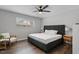 Bedroom featuring a large bed, wood floors, and a ceiling fan at 130 S Estes Dr # G3, Chapel Hill, NC 27514