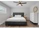Bedroom featuring a large bed, wood floors, ceiling fan, and lots of light at 130 S Estes Dr # G3, Chapel Hill, NC 27514