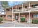 Charming brick townhouse featuring a covered balcony and well-maintained landscaping at 130 S Estes Dr # G3, Chapel Hill, NC 27514
