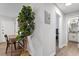 Hallway that leads to the bathroom, with a desk area and wood floors at 130 S Estes Dr # G3, Chapel Hill, NC 27514