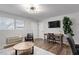 Open living space with wood flooring, a desk, and lots of natural light at 130 S Estes Dr # G3, Chapel Hill, NC 27514