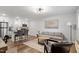 Open-concept living space with kitchen island and modern living room decor at 130 S Estes Dr # G3, Chapel Hill, NC 27514