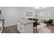 Inviting living room with a view of the modern kitchen and island seating at 130 S Estes Dr # G3, Chapel Hill, NC 27514