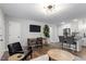 Bright living room featuring a desk area, breakfast bar, and modern lighting fixtures at 130 S Estes Dr # G3, Chapel Hill, NC 27514