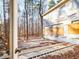 View of backyard and exterior of home with exposed building materials and wooden planks at 18 Wedgewood Ct, Chapel Hill, NC 27514