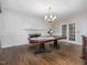 Spacious dining room with a large table, fireplace, and elegant decor, perfect for entertaining at 18 Wedgewood Ct, Chapel Hill, NC 27514