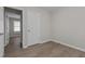 Bright bedroom with light wood flooring and view to adjacent room at 200 Westbury Dr, Oxford, NC 27565