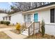 Close up of the front door with wood railing at 200 Westbury Dr, Oxford, NC 27565