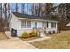Inviting one-story home with white siding, blue door, and tidy front yard at 200 Westbury Dr, Oxford, NC 27565
