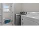 Laundry room featuring new washer and dryer, blue rug, and view to commode at 200 Westbury Dr, Oxford, NC 27565