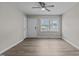 Living room with front door, big window, ceiling fan, and light wood flooring at 200 Westbury Dr, Oxford, NC 27565