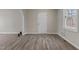 Neutral living room with light wood flooring, and large window at 200 Westbury Dr, Oxford, NC 27565
