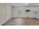 Living room featuring white walls, light wood flooring, window, and front door at 200 Westbury Dr, Oxford, NC 27565