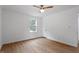 Bedroom with hardwood floors, a ceiling fan, and a window at 2001 Rolesville Rd, Wake Forest, NC 27587